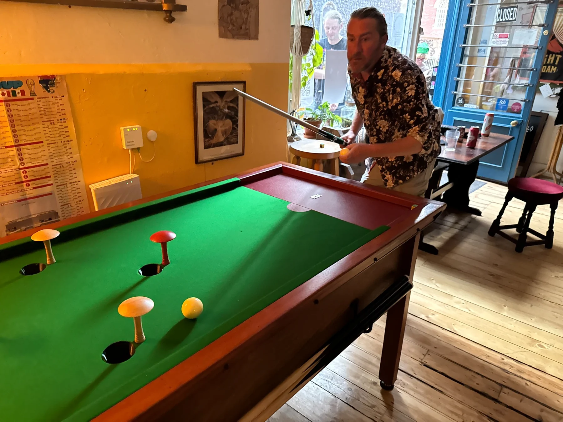 A player lining up a shot at The Holloway